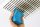A hand with scourer cleaning a dirty ceiling vent